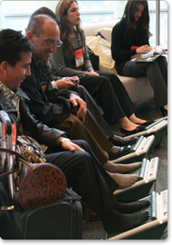 Trade show attendees waiting for their chair massage